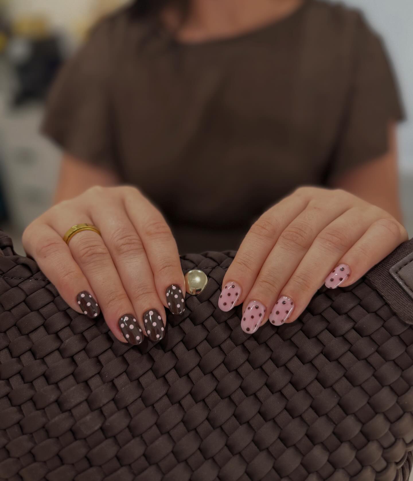 Brown and pink polka dot nails, styled