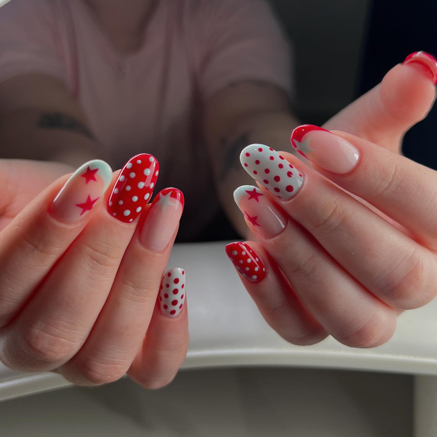 Red and white polka dot and star manicure